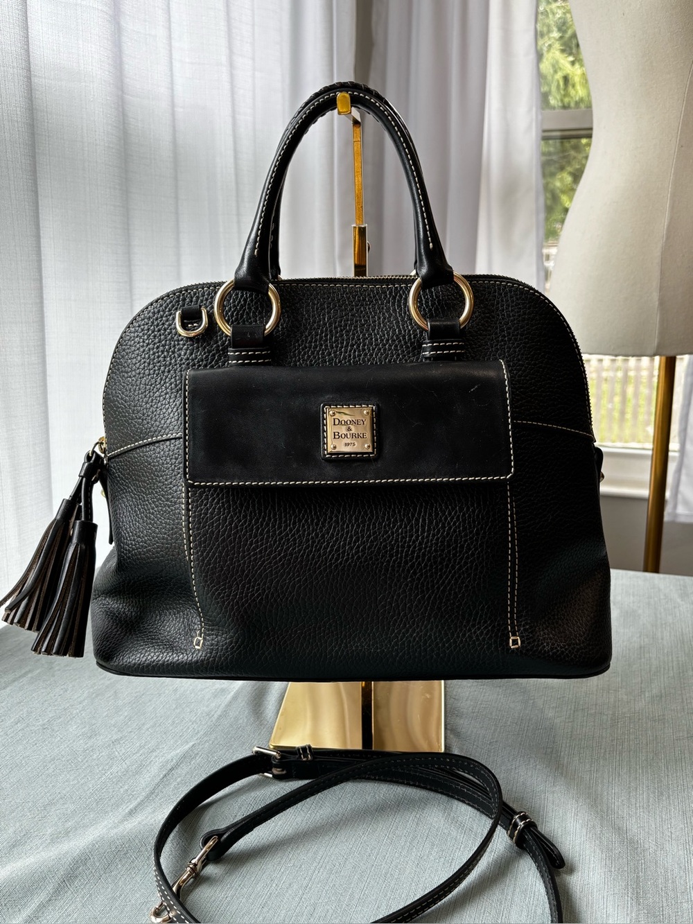 Dooney & Bourke Black Leather Satchel with Gold Hardware and Tassel